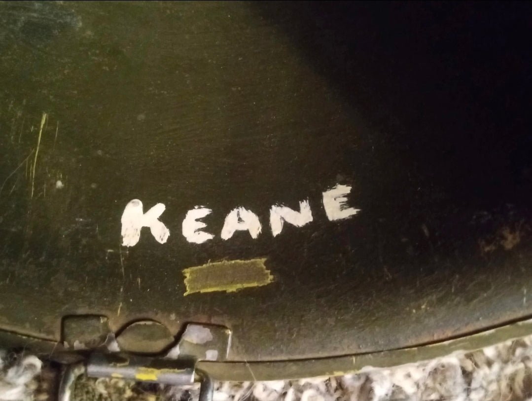 Authentic WWII U.S. Army M1 steel helmet shell, featuring honest battlefield wear and a hand - painted soldier name: “Keane” - Workshop & Study