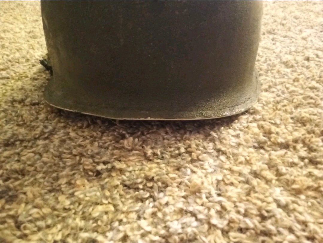 Authentic WWII U.S. Army M1 steel helmet shell, featuring honest battlefield wear and a hand - painted soldier name: “Keane” - Workshop & Study