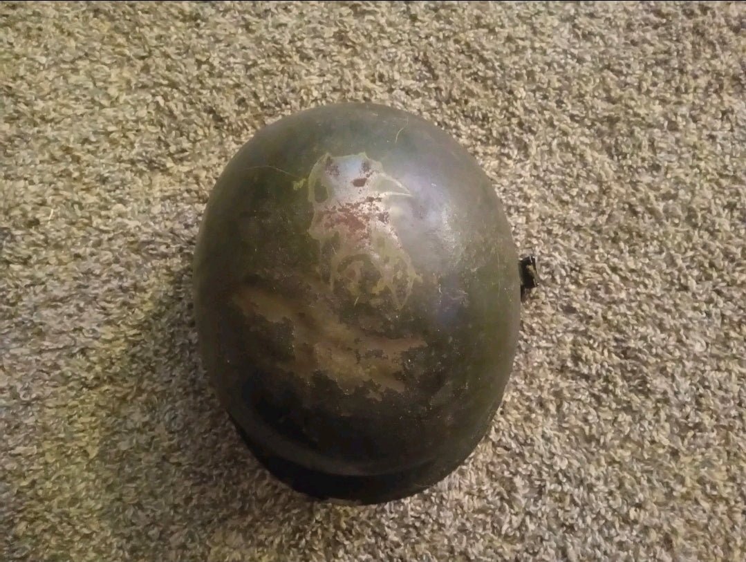 Authentic WWII U.S. Army M1 steel helmet shell, featuring honest battlefield wear and a hand - painted soldier name: “Keane” - Workshop & Study